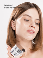 Woman holding a Paradigm99 Super Glow Hydrating Face Cream with text 'Radiance. Truly instant result.'